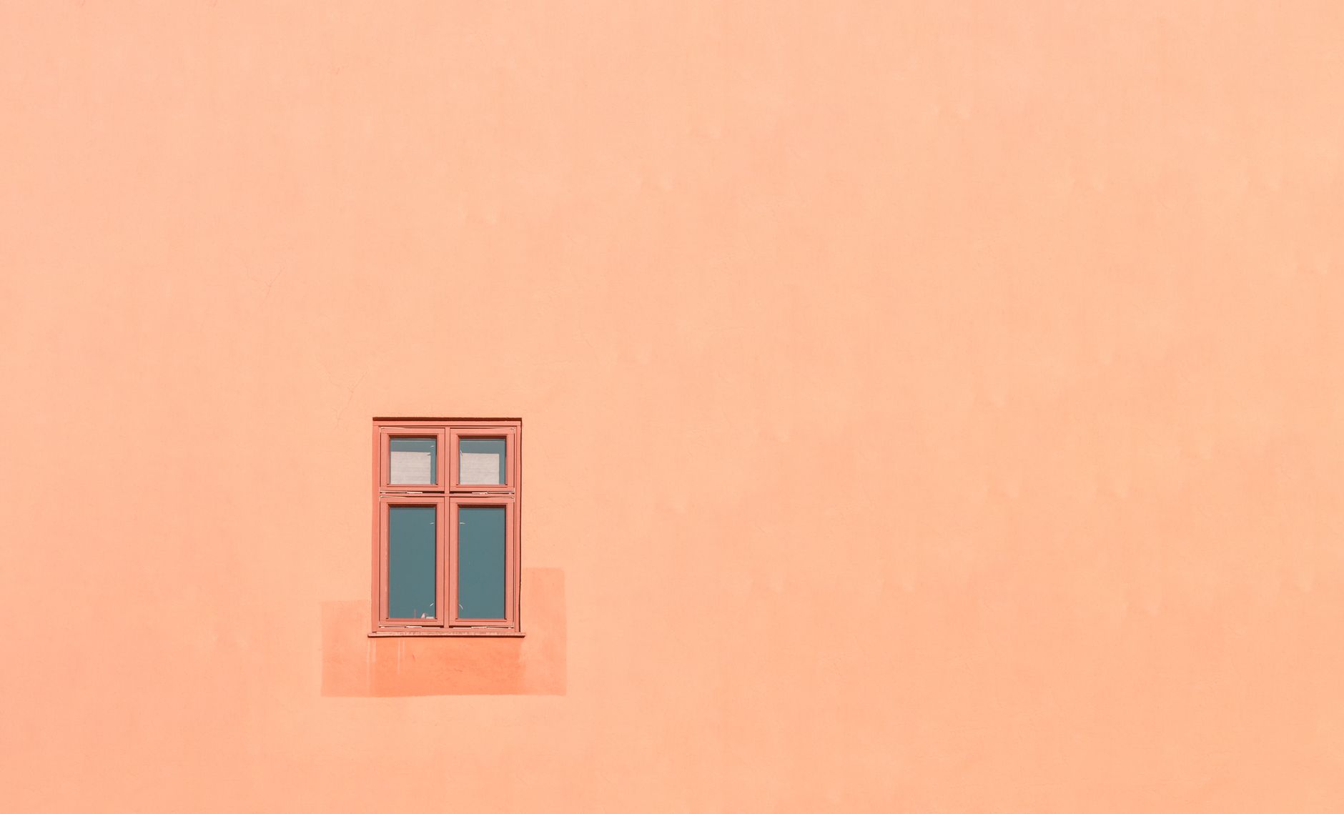 windows on orange building wall